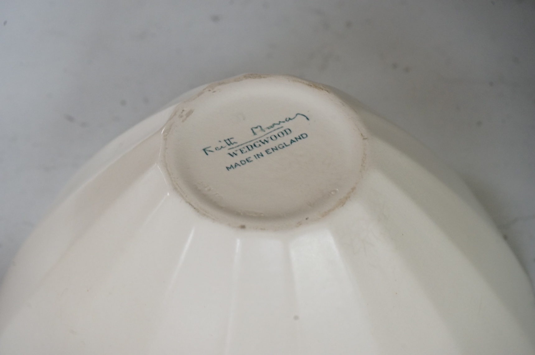 Keith Murray for Wedgwood, a cream conical bowl, 25cm diameter